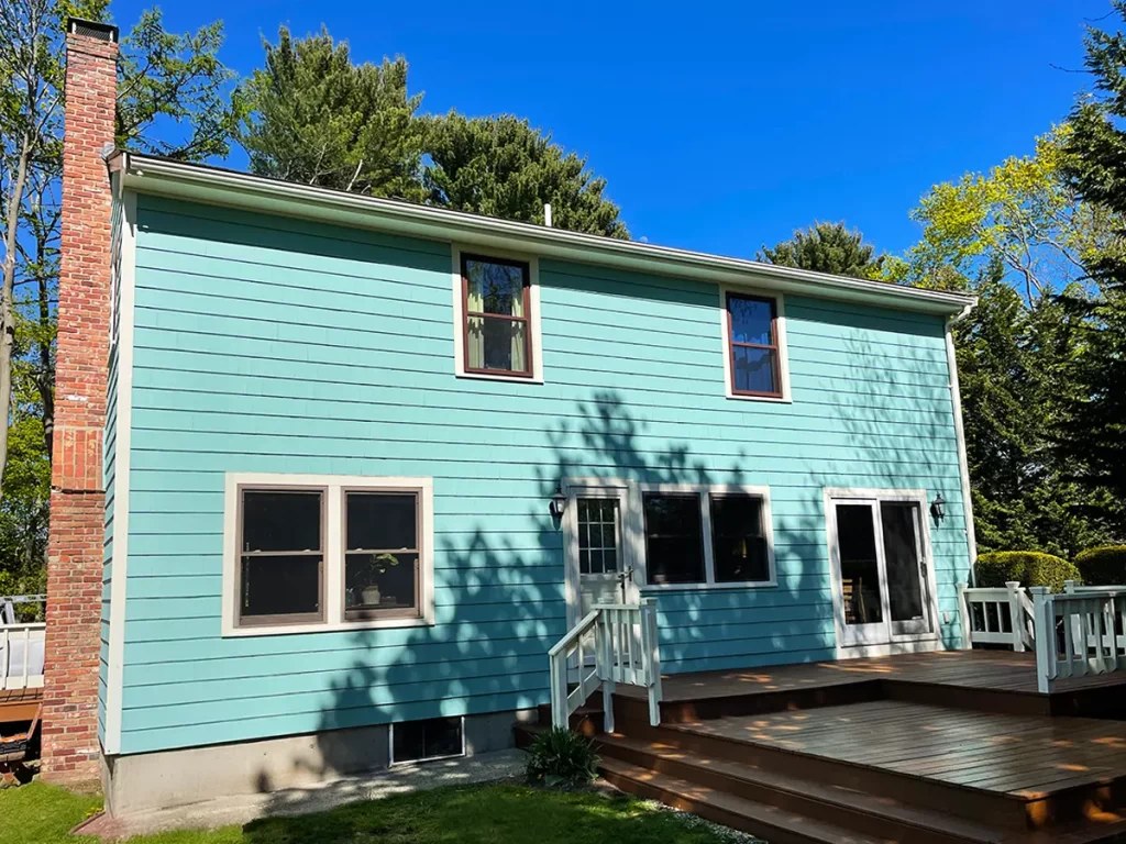 A freshly painted turquoise two-story home exterior by Sherwood Painting